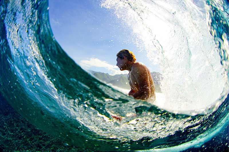 'Two Worlds' - Parker Coffin above and below the reef in Tahiti. Photo by Zak Noyle